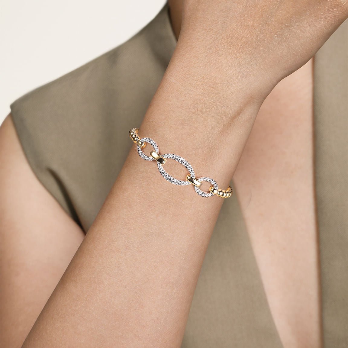 Bracelet flex bangle with 3 diamond open ovals on top 2 - tone karat gold by Gabriel - Gaines Jewelers