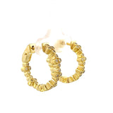 Earrings set with diamond clusters, hoop style inside - out 14kt yellow gold - Gaines Jewelers