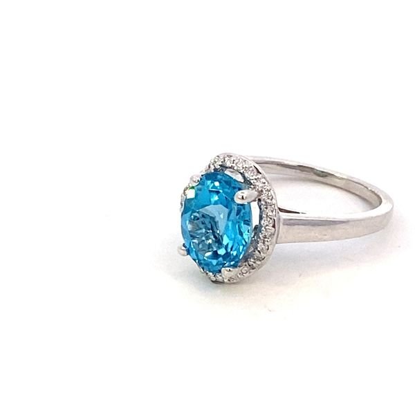 Ring- blue topaz set in a scalloped halo 14kt white gold - Gaines Jewelers