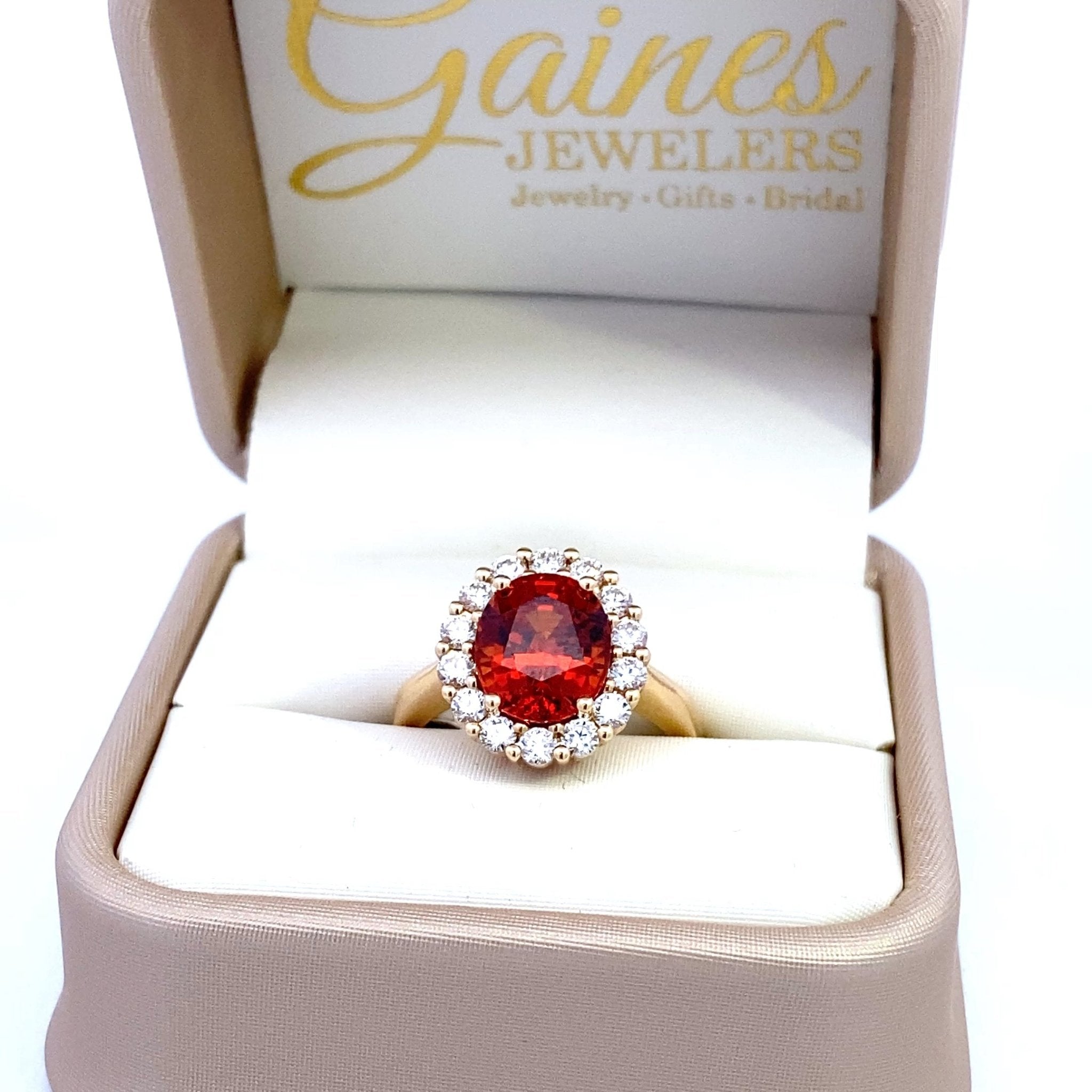 Ring set with a mandarin garnet surrounded by diamonds 14kt yellow gold by Rego - Gaines Jewelers
