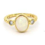 Ring set with an opal and accented with diamonds 14kt yellow gold - Gaines Jewelers