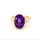 Ring set with an oval amethyst flanked by half moon lab diamonds 14kt yellow gold - Gaines Jewelers