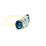 Ring with Sky blue topaz flanked by London blue topaz 14kt yellow gold - Gaines Jewelers
