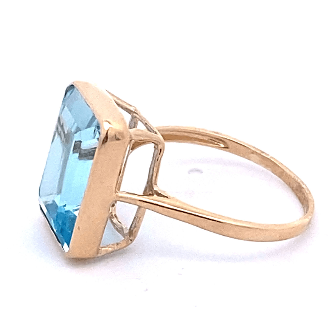 Ring blue topaz emerald cut bezel - Gaines Jewelers