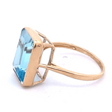 Ring blue topaz emerald cut bezel - Gaines Jewelers