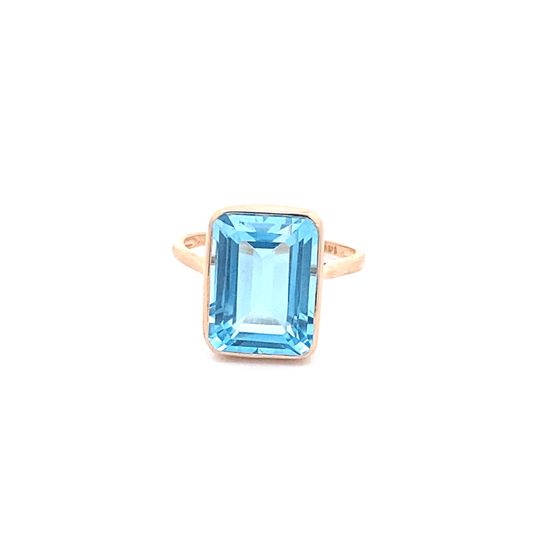 Ring blue topaz emerald cut bezel - Gaines Jewelers