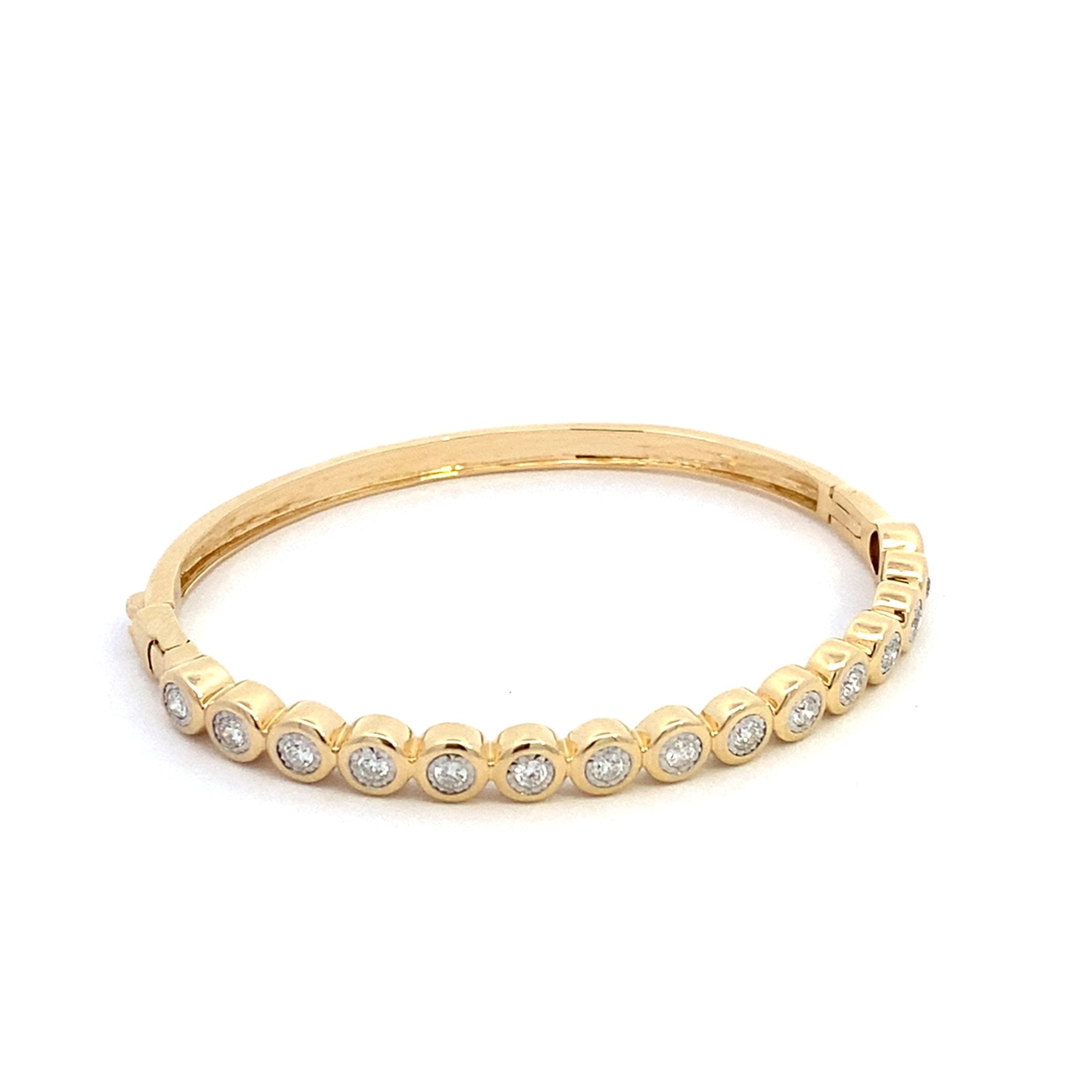 Bangle bracelet with bezel set diamonds in 14kt yellow gold by Sophia - Gaines Jewelers
