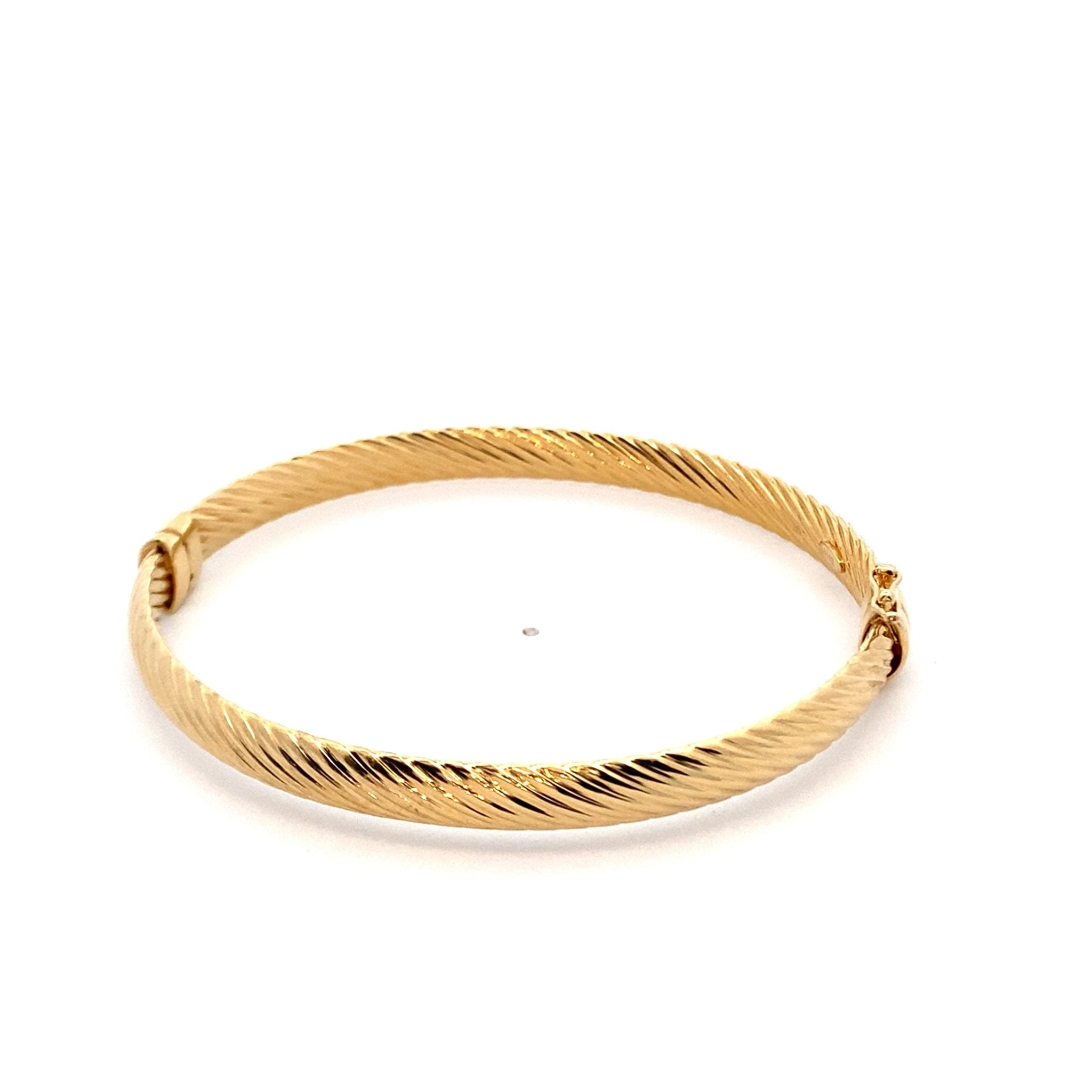 Bangle bracelet with hinged closure, diagonal ribbed texture, 6mm, 14kt yellow gold - Gaines Jewelers