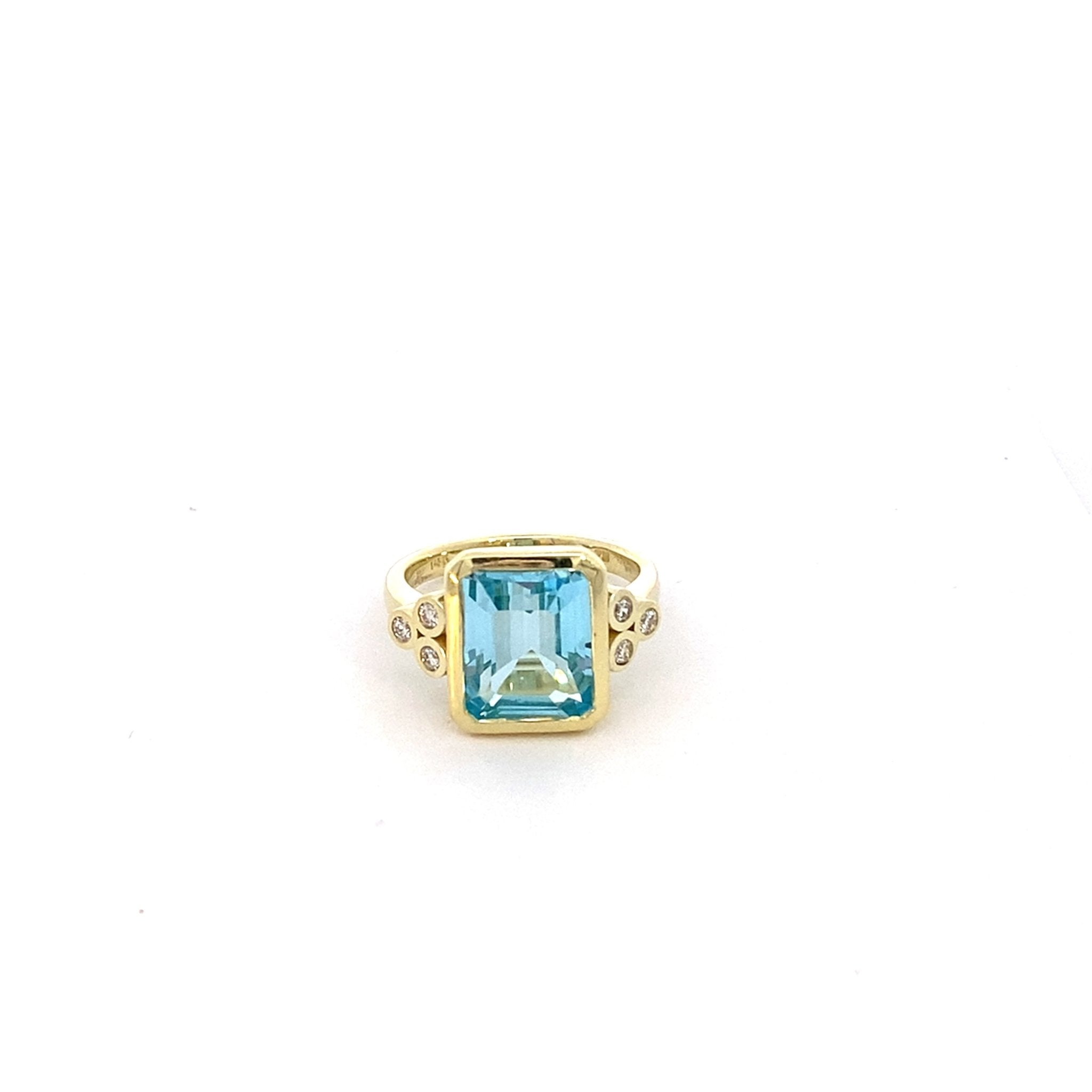 Blue topaz ring flanked by 3 bezel set diamonds 14kt yellow gold by Raymond Mazza - Gaines Jewelers