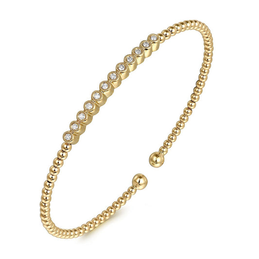 Bracelet flex cuff bangle with top bar set with 12 diamonds 14kt yellow gold - Gaines Jewelers