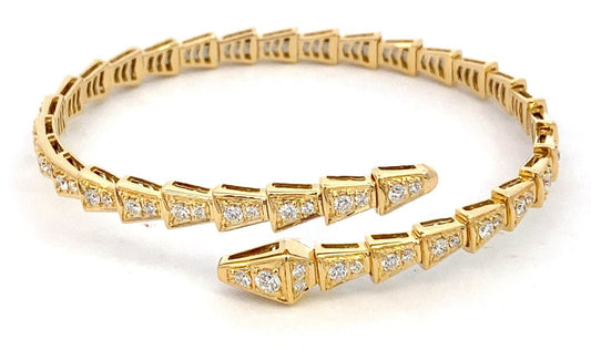 Bracelet, serpentine wrap style with diamonds 14kt yellow gold - Gaines Jewelers