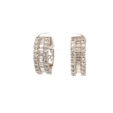 Diamond hoop earrings with center baguettes edged by rounds 18kt white gold by Hakman - Gaines Jewelers