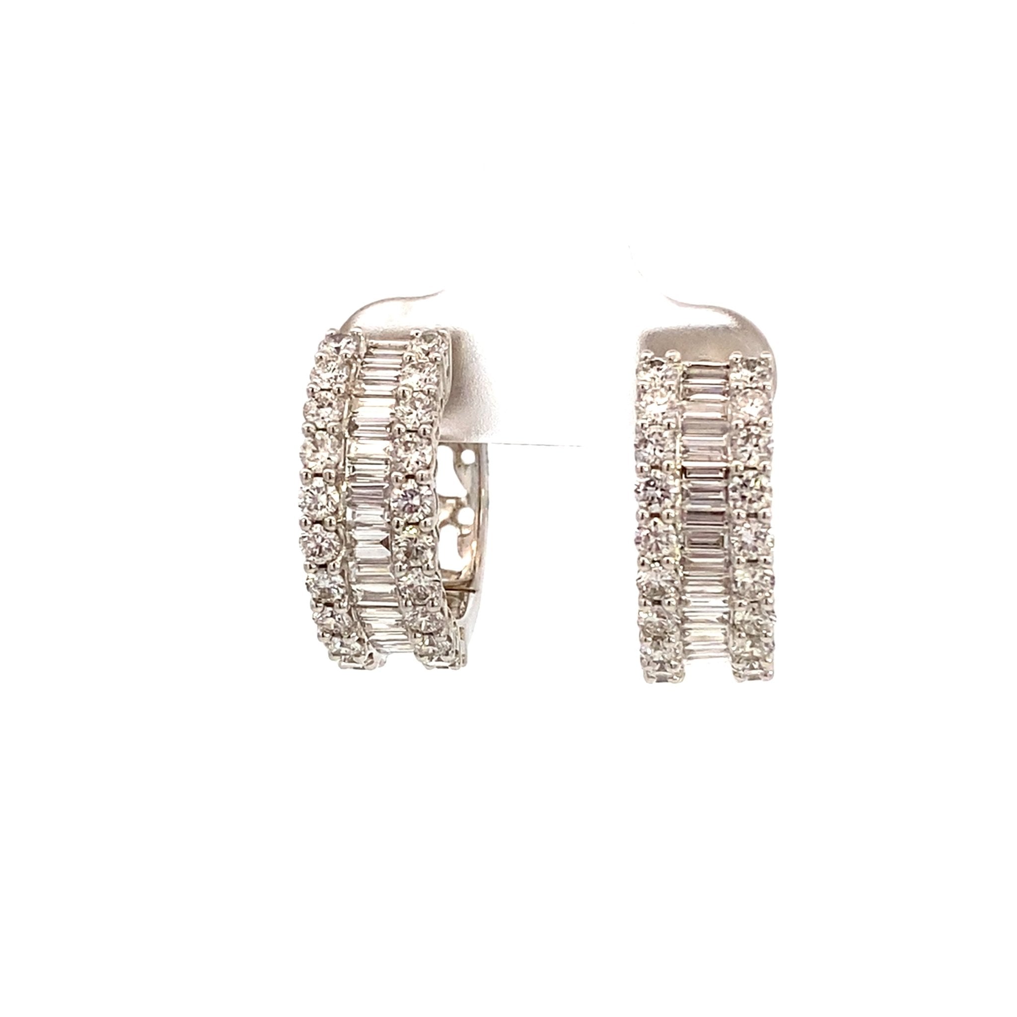 Diamond hoop earrings with center baguettes edged by rounds 18kt white gold by Hakman - Gaines Jewelers