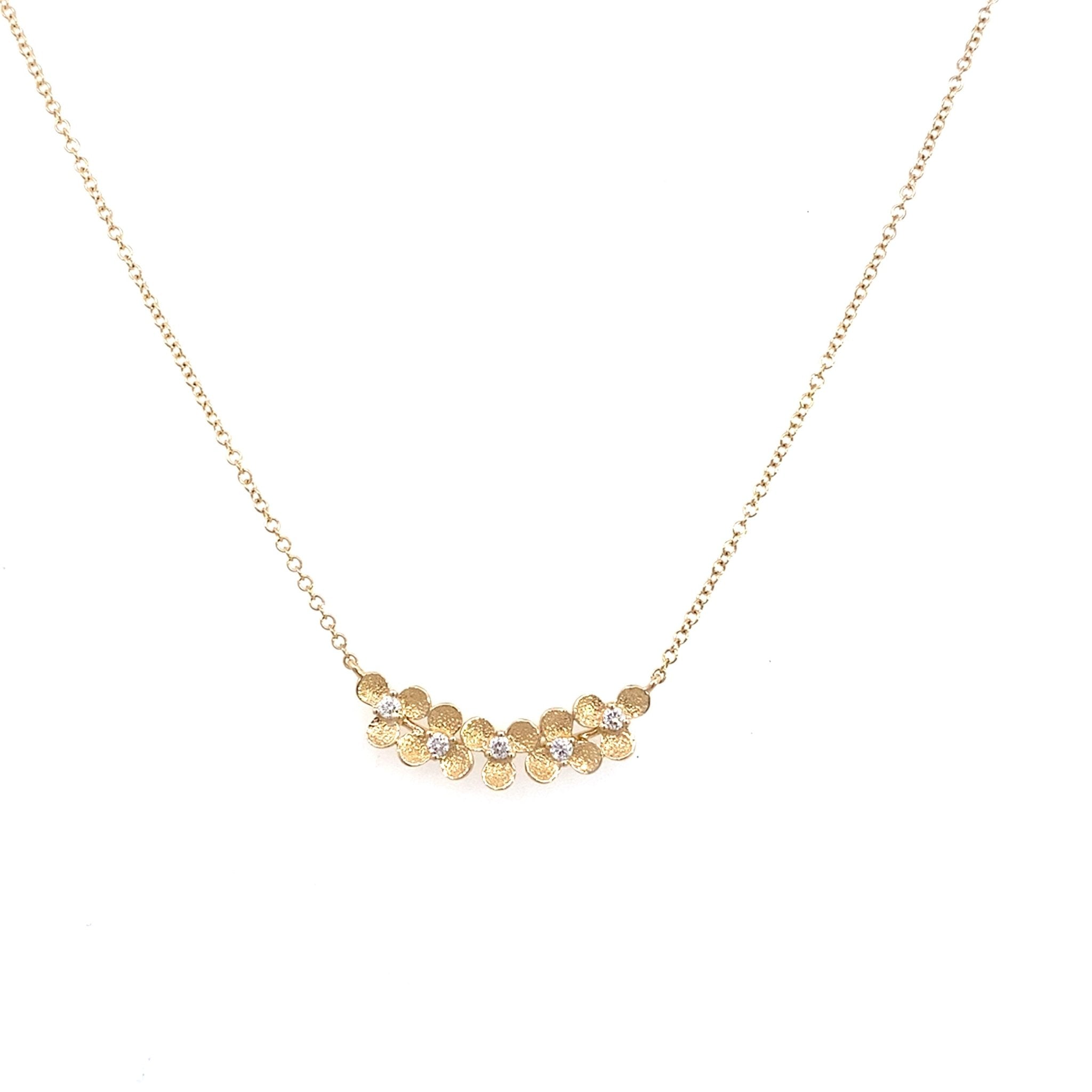 Diamond necklace with 5 floral motifs at front as trapeze in 14kt yellow gold by Bassali - Gaines Jewelers
