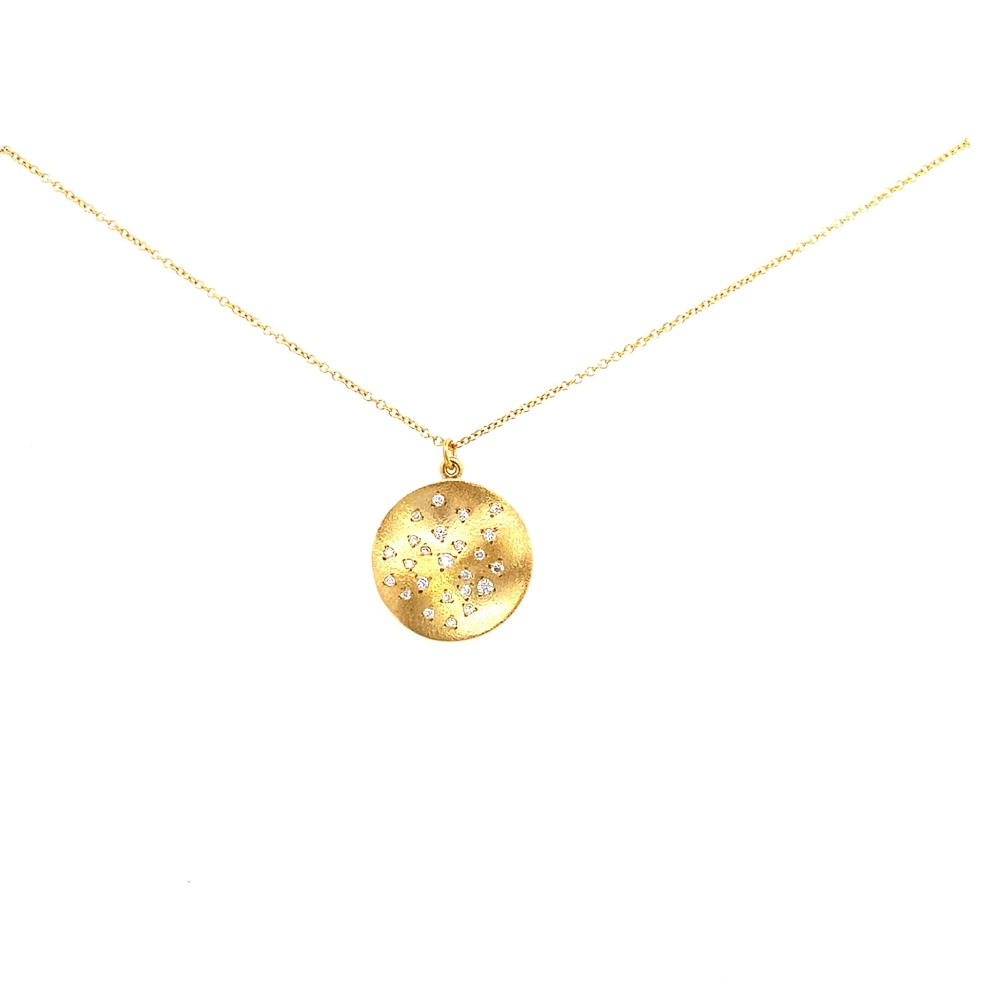 Diamond pendant with a round wavy disc burnish set with tiny diamonds in 14kt yellow gold by Marika - Gaines Jewelers