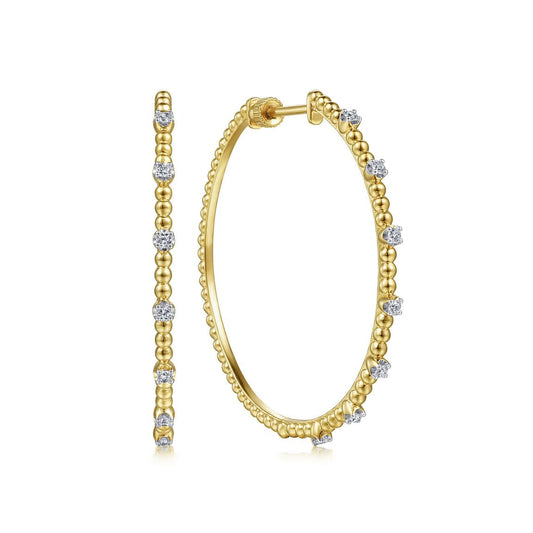 Earrings hoop style with diamond stations 14kt yellow gold - Gaines Jewelers