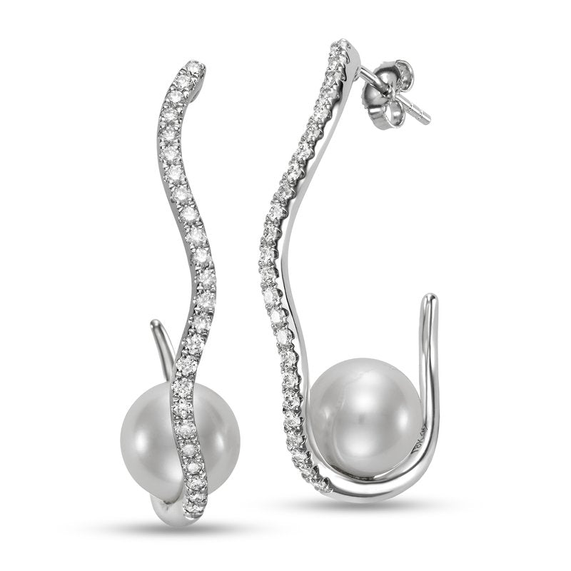 Earrings set with a large pearl sitting in an abstract loop of diamonds 18kt white gold - Gaines Jewelers