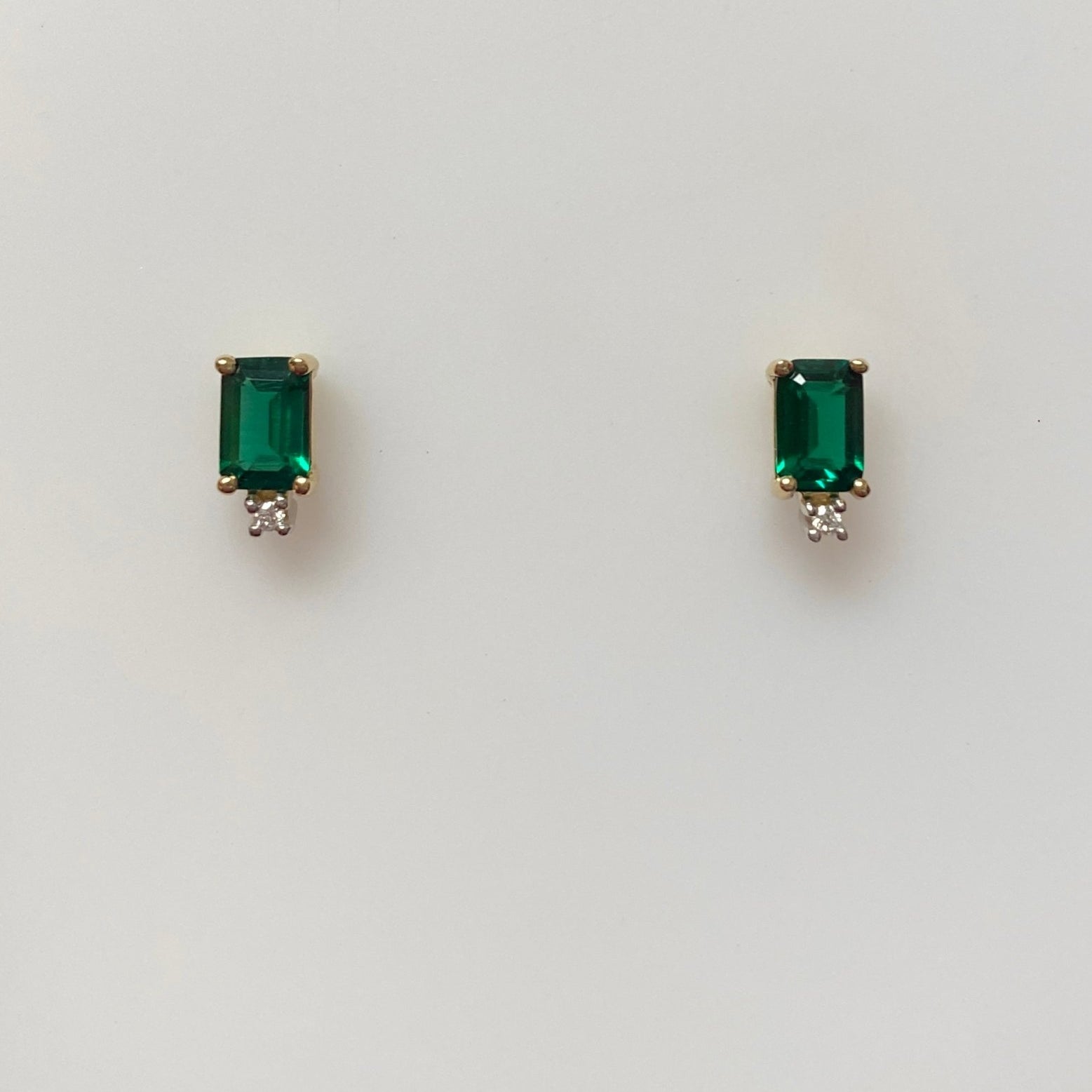 Lab Emeralds, Emerald Cut with Tiny Diamond at Bottom 14kt Yellow Gold Stud Earring - Rego - Gaines Jewelers