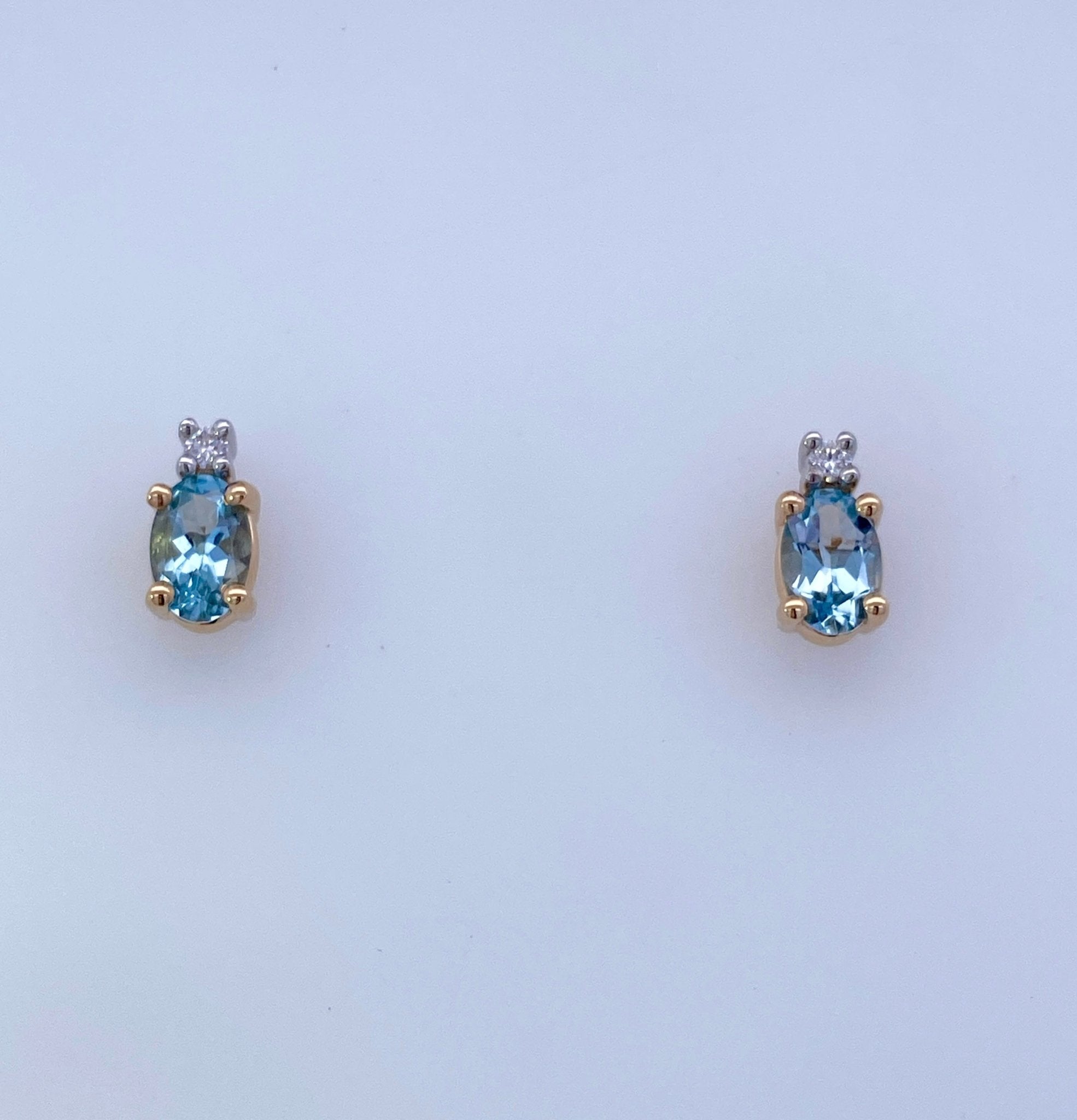 Oval Aqua and diamond Stud Earrings 14kt Yellow Gold - Rego - Gaines Jewelers