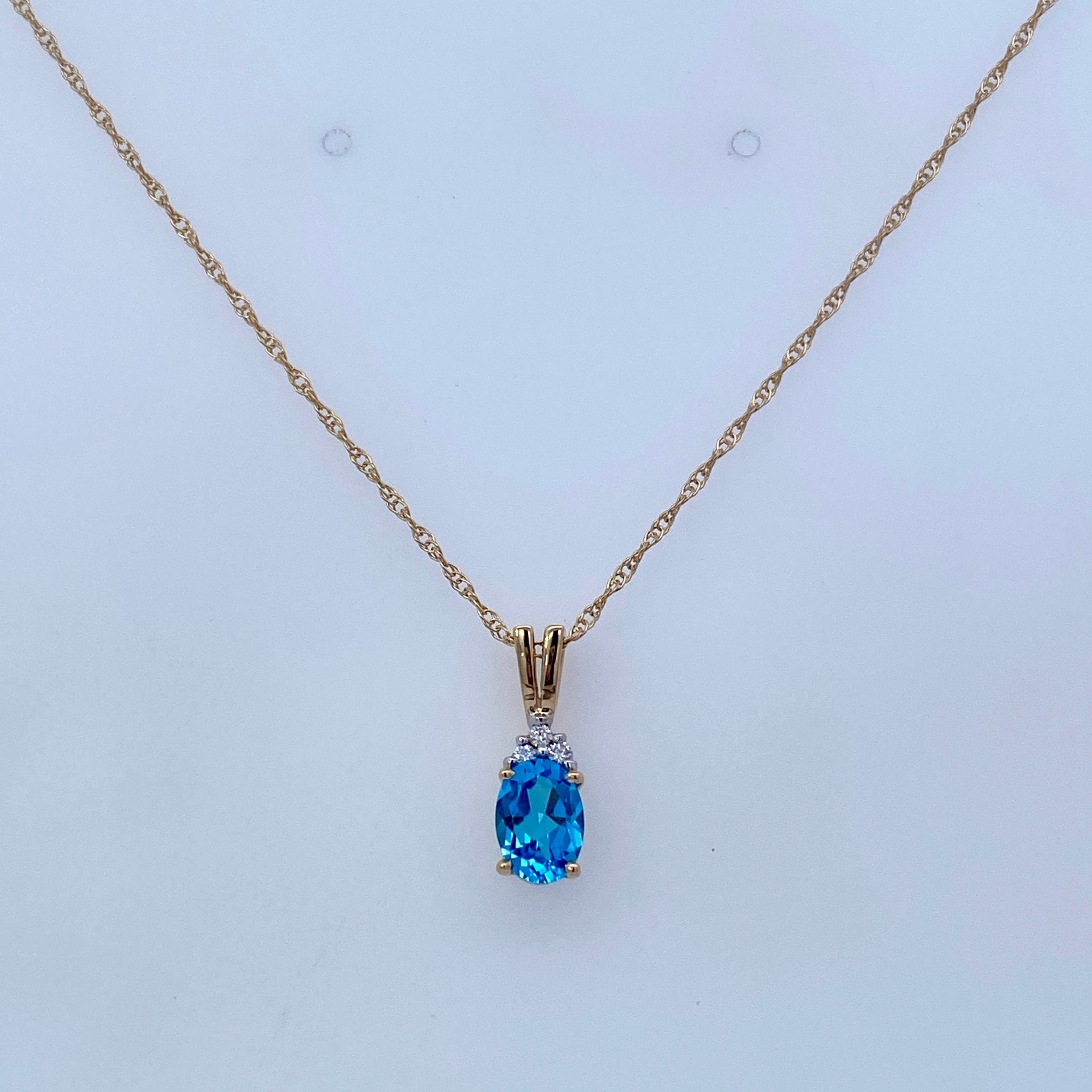Oval Blue Topaz with Diamonds at Top 14kt Yellow Gold Pendant - Rego - Gaines Jewelers