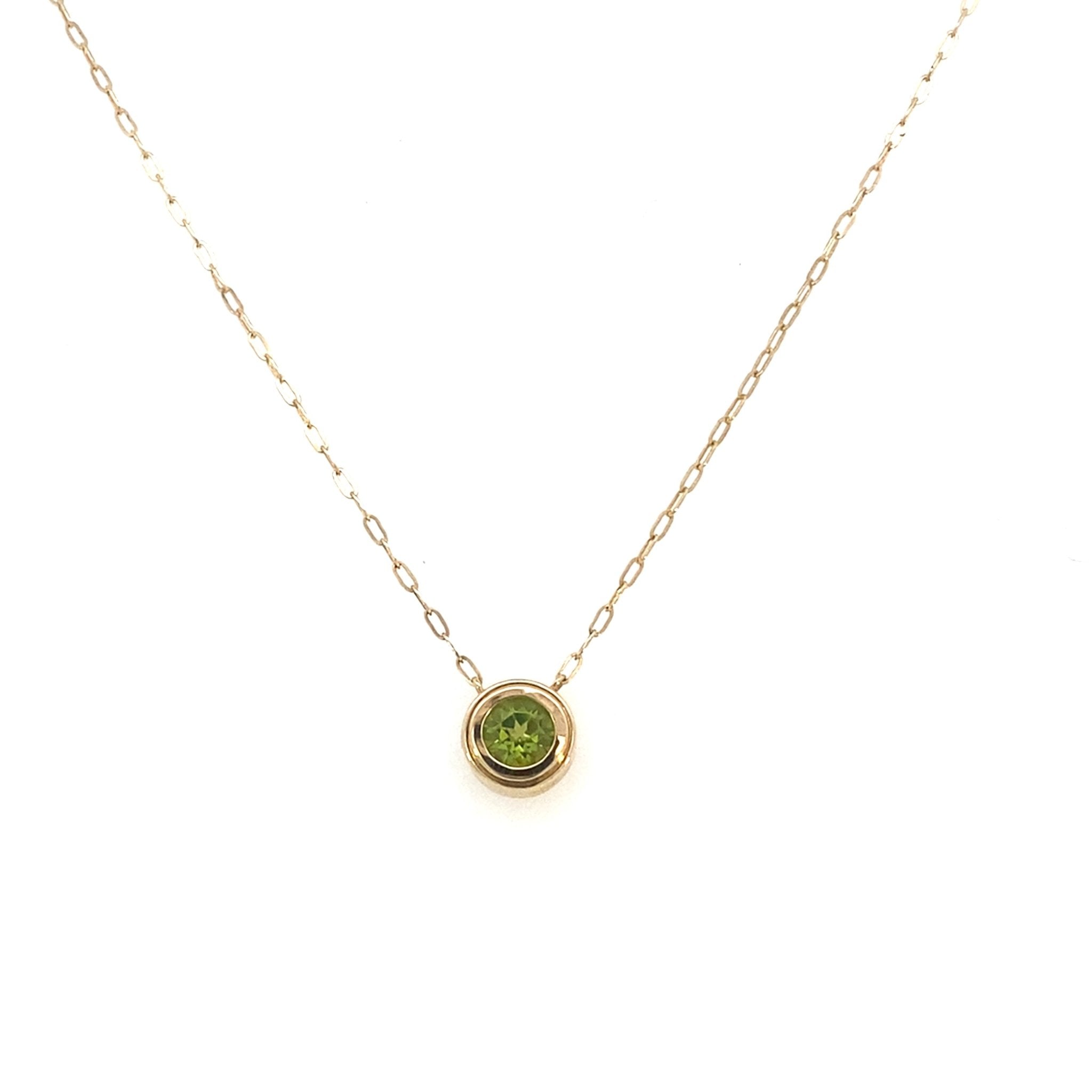Pendant - round peridot in bezel on paperclip chain 14kt yellow gold - Gaines Jewelers