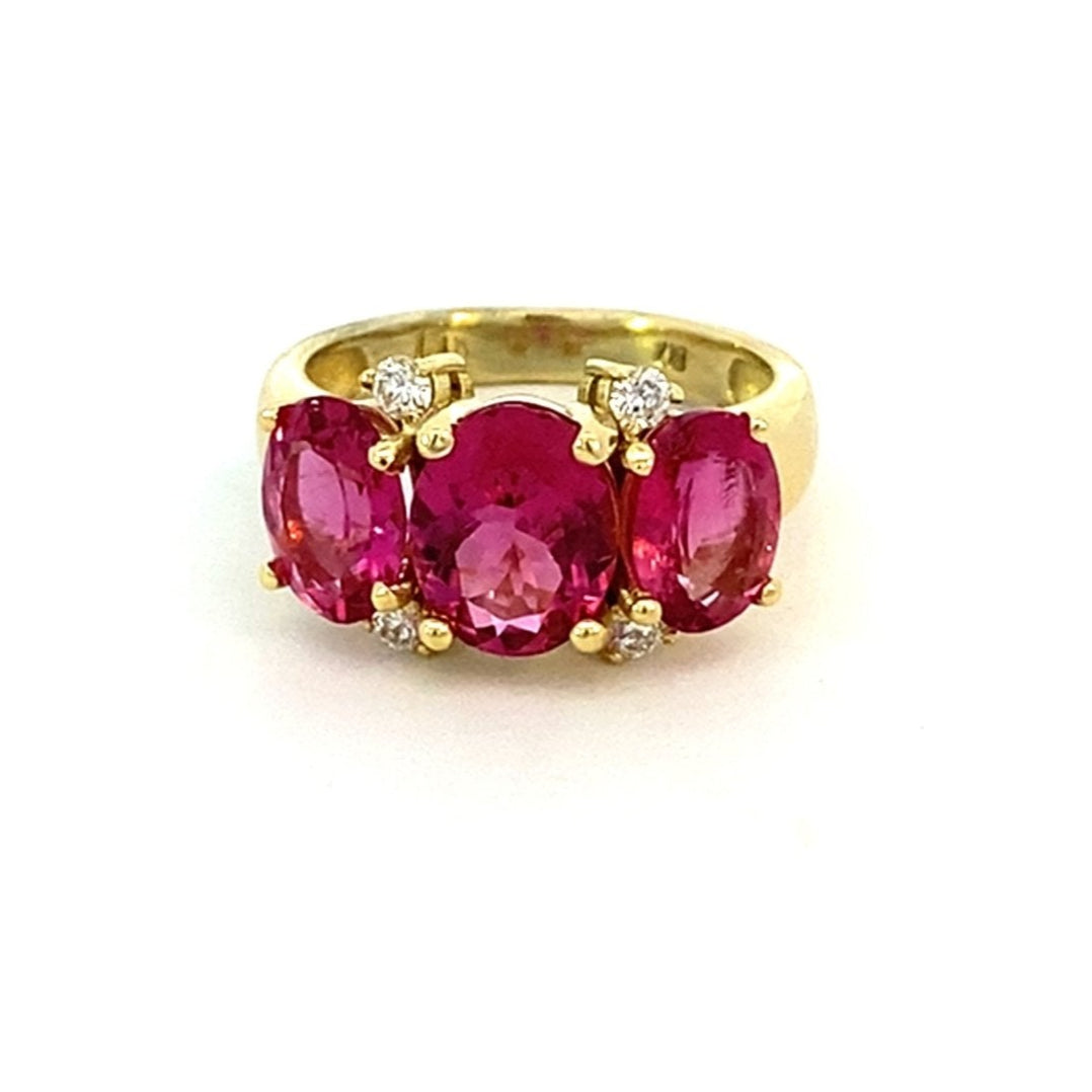 Pink tourmaline ring with 3 stones accented with diamonds in 18kt yellow gold - Gaines Jewelers