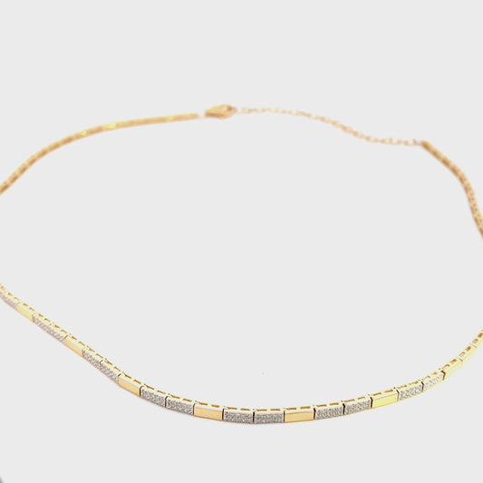 Necklace designed with alternating diamond and gold sections 14kt yellow gold