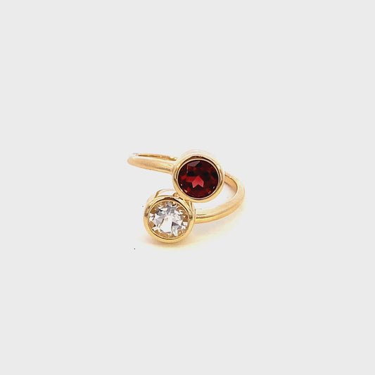 Ring garnet and white topaz bypass style 14kt yellow gold