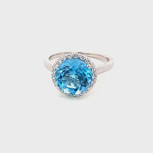 Ring- blue topaz ring with diamond halo 14kt white gold