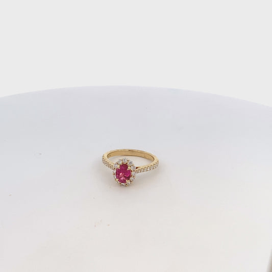 Ring- pink spinel center with diamond halo and shank 14kt yellow gold