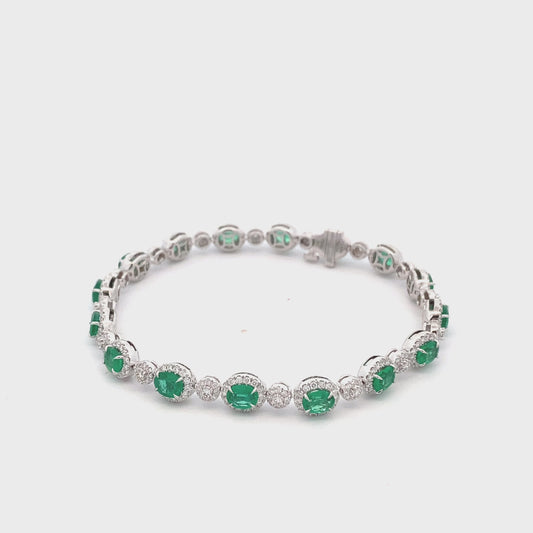 Bracelet- emerald straight line style with diamond halos 18kt white gold