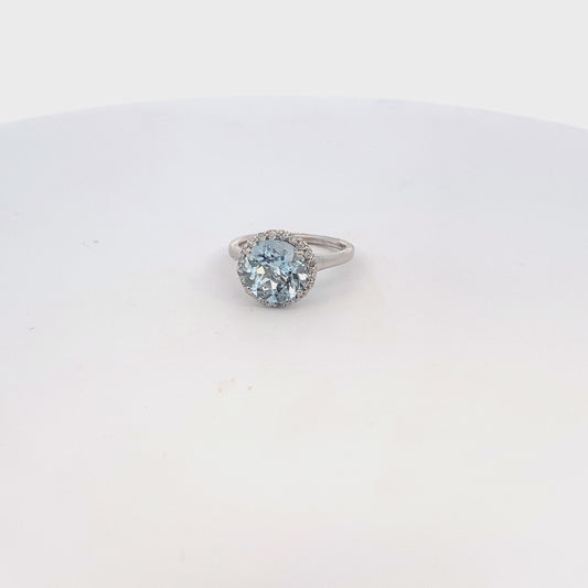 Aquamarine ring with 10mm round aqua stone with diamond halo 14kt white gold