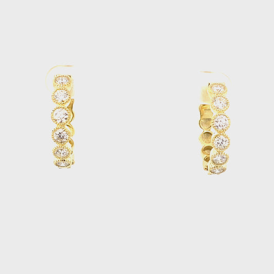 Earrings diamond hoops set in coin edge bezels 14kt yellow gold