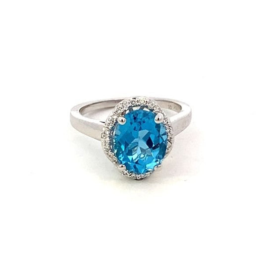 Ring- blue topaz set in a scalloped halo 14kt white gold - Gaines Jewelers