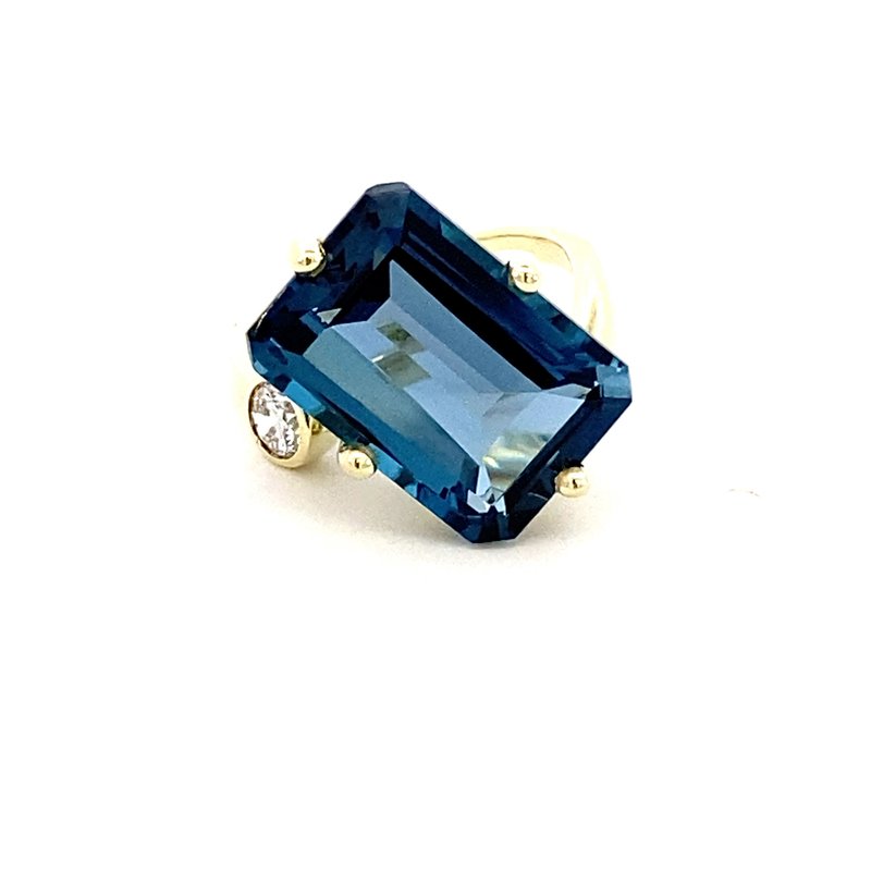 Ring in a bypass style set with a large London blue topaz 14kt yellow gold - Gaines Jewelers