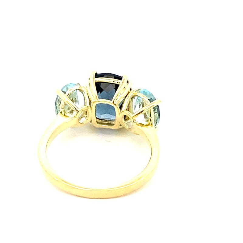 Ring set with a center London blue topaz flanked by Sky blue topaz 14kt yellow gold - Gaines Jewelers