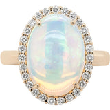 Ring set with a large oval opal surrounded by diamonds 14kt yellow gold - Gaines Jewelers