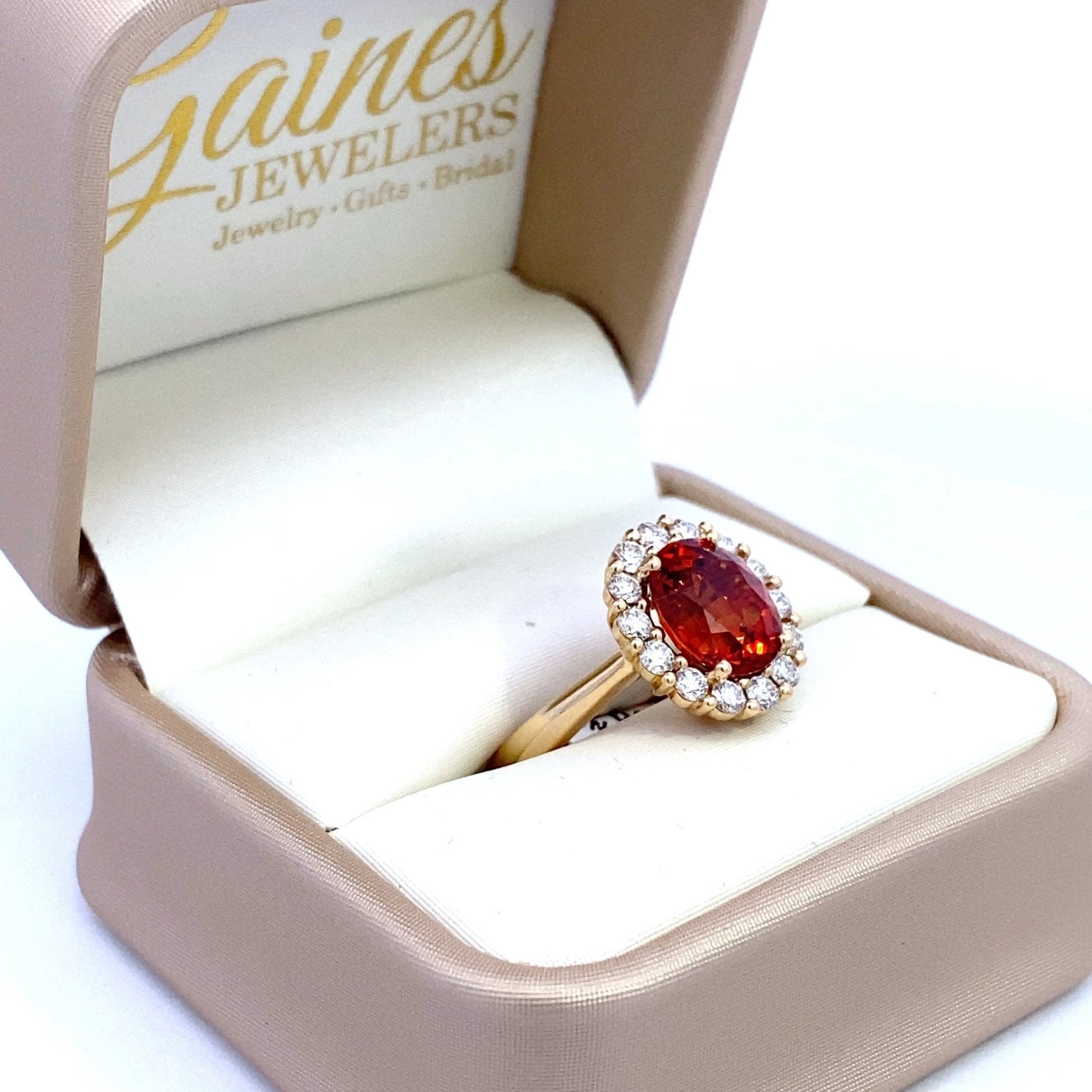 Ring set with a mandarin garnet surrounded by diamonds 14kt yellow gold by Rego - Gaines Jewelers