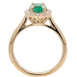 Ring set with an oval emerald surrounded by a diamond halo 14kt yellow gold - Gaines Jewelers