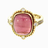 Ring set with pink tourmaline, diamond shank in 14kt yellow gold by Raymond Mazza - Gaines Jewelers