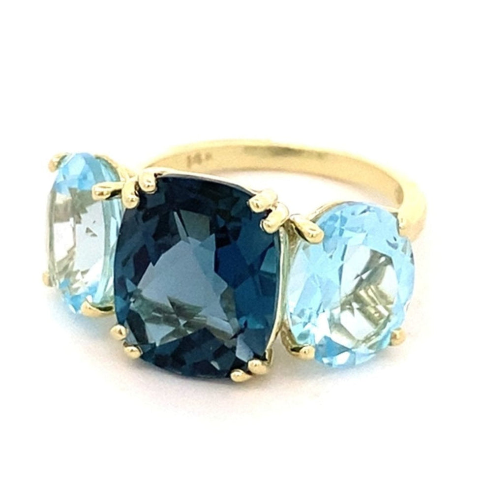 Ring with London blue topaz flanked by sky blue topaz 14kt yellow gold - Gaines Jewelers