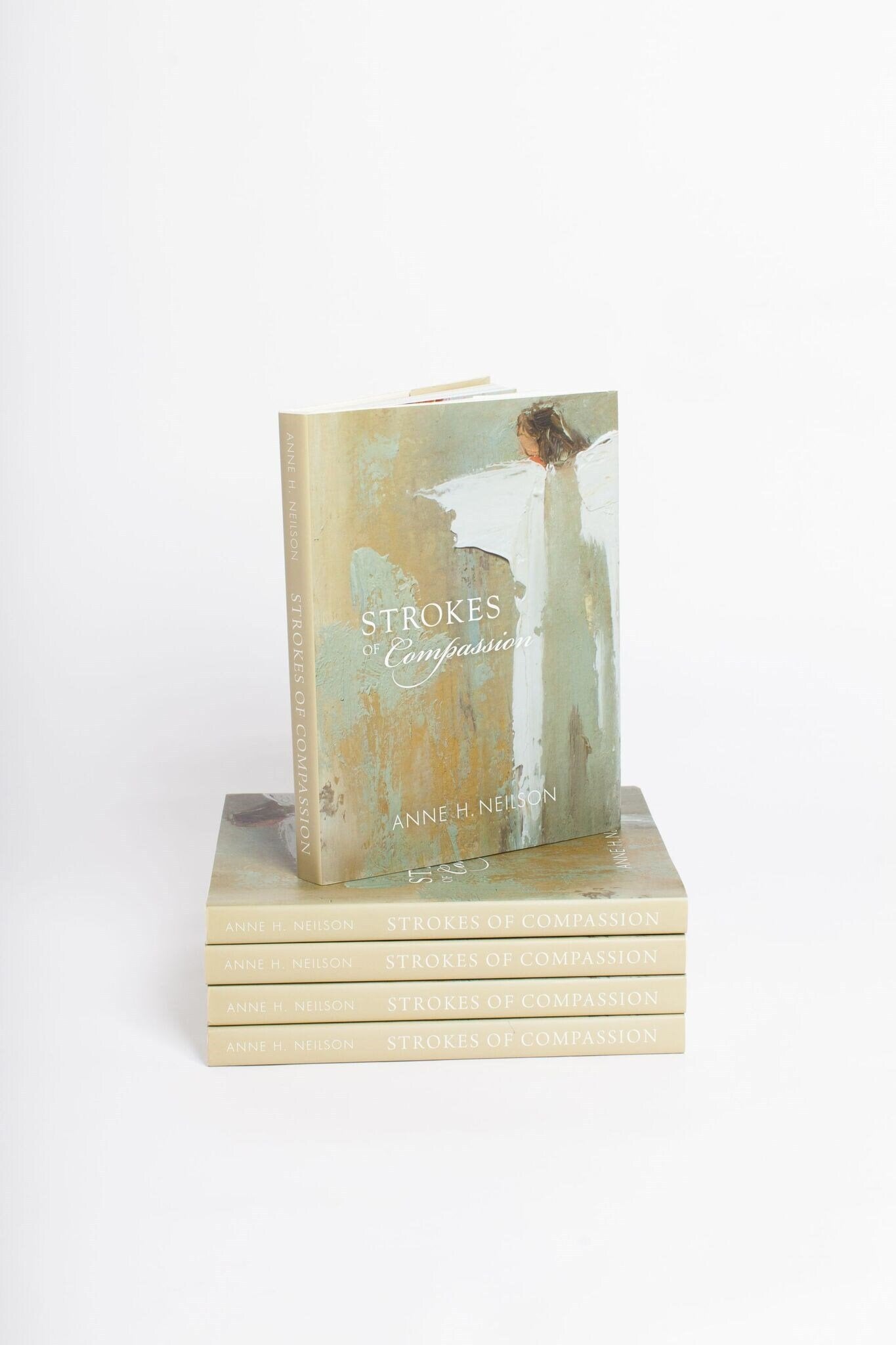 Strokes of Compassion Book - Anne Neilson Home - Gaines Jewelers