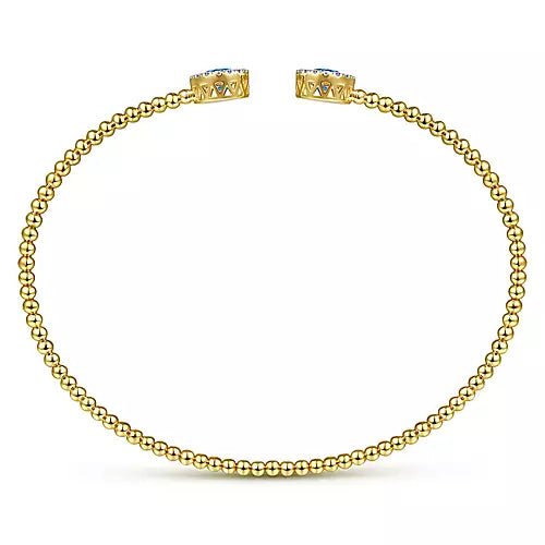 14K Yellow Gold Round Blue Topaz and Diamond Halo Bujukan Bangle - Gaines Jewelers
