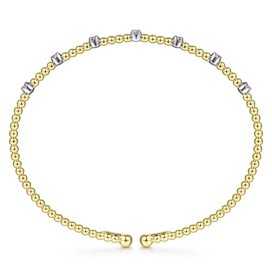 Bracelet- 14k yellow gold bead cuff 7 diamond stations on top - Gaines Jewelers