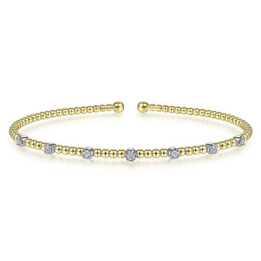 Bracelet- 14k yellow gold bead cuff 7 diamond stations on top - Gaines Jewelers