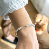 Bracelet- 6mm bangle bracelet with oval shape diamond cluster on top - Gaines Jewelers
