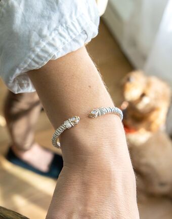 Bracelet- 6mm bangle bracelet with oval shape diamond cluster on top - Gaines Jewelers