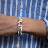 Bracelet- 6mm bangle bracelet with oval shape diamond cluster on top - Gaines Jewelers