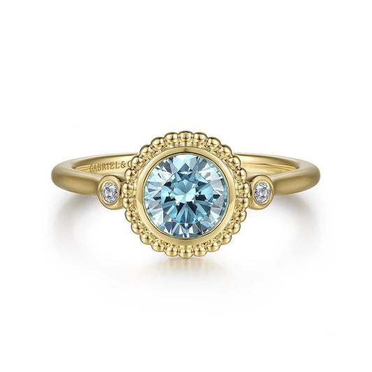 Ring blue topaz and diamond in bead bezel 14kt yellow gold - Gaines Jewelers
