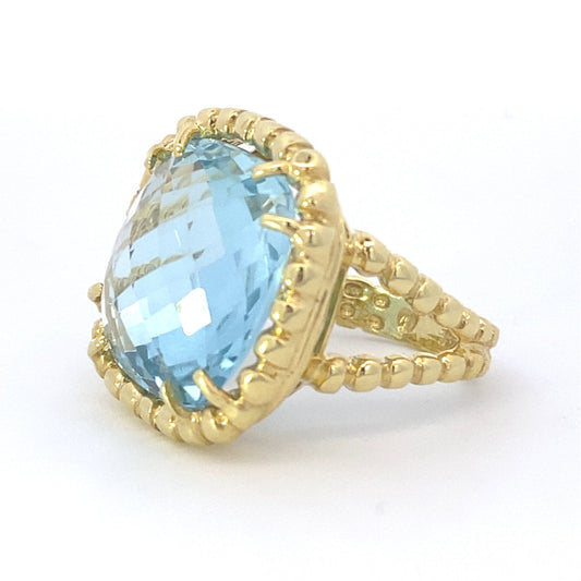 Ring blue topaz cushion with braided halo and shank - Gaines Jewelers